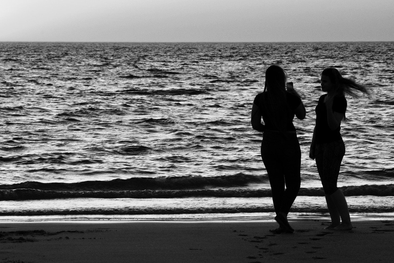 silhouette, couple, couple silhouette, people, female, sunset, two, young, together, water, sand, beach, friends, summer, casual, women, nature, horizon, gray beach, gray sunset, gray summer, gray sand, gray together